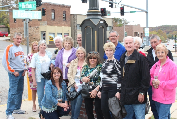 Members of Citizens Security Bank Horizons Club (Bixby, OK) pose at the corner of Historic Route 66 in downtown Waynesville during their 